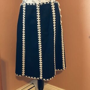 Warm wool skirt with chunky stitch details and covered side buttons